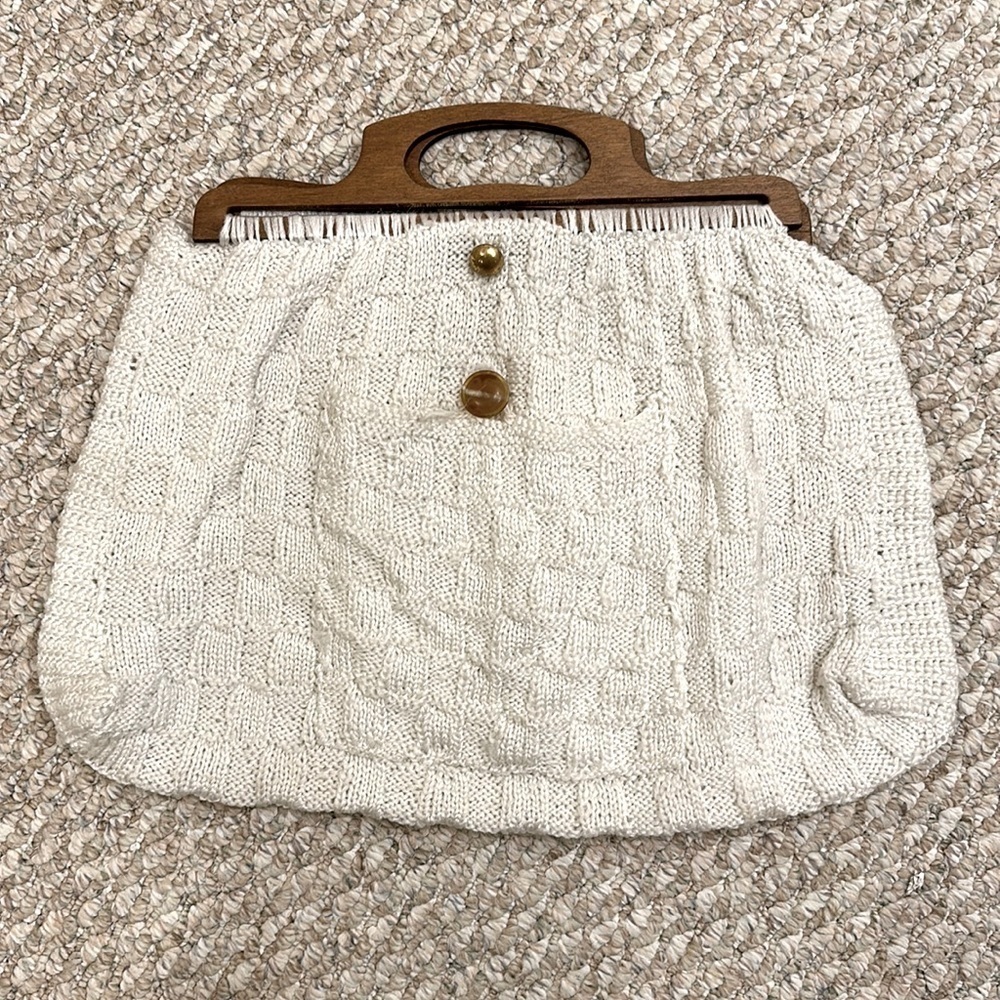 Vintage crochet cream handbag with wooden handles pocket in front and buttons